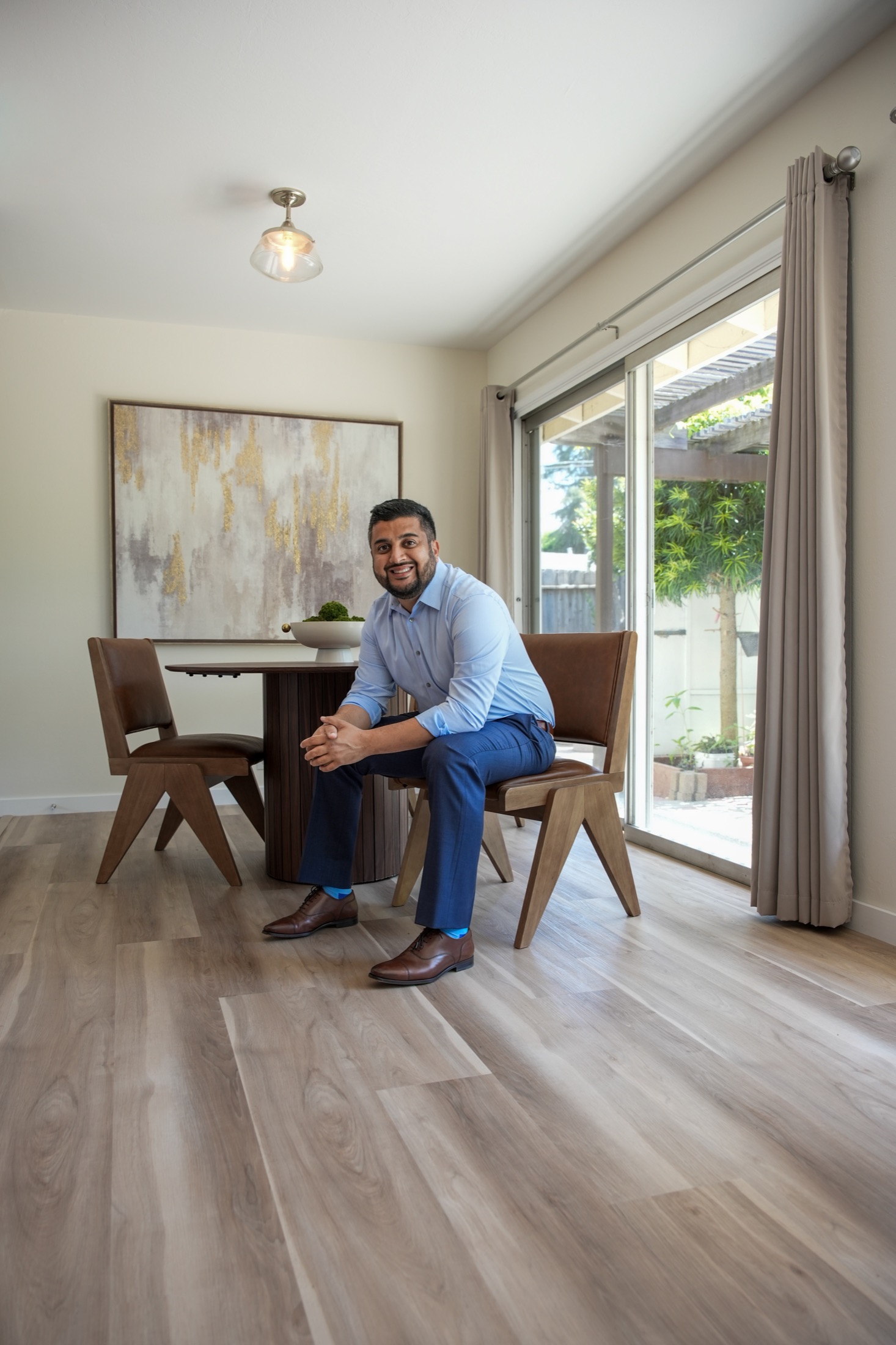 Muzamil Khan at a dining table during a buyer consultation